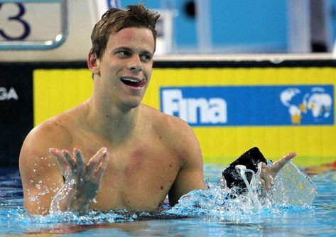 Brazilian swimmer Cesar Cielo jubilates after winning the gold medal in the men's 100m freestyle during the 10th FINA World Swimming Championships (25m) 2010 in Dubai, December 19, 2010. AFP PHOTO/MARWAN NAAMANI